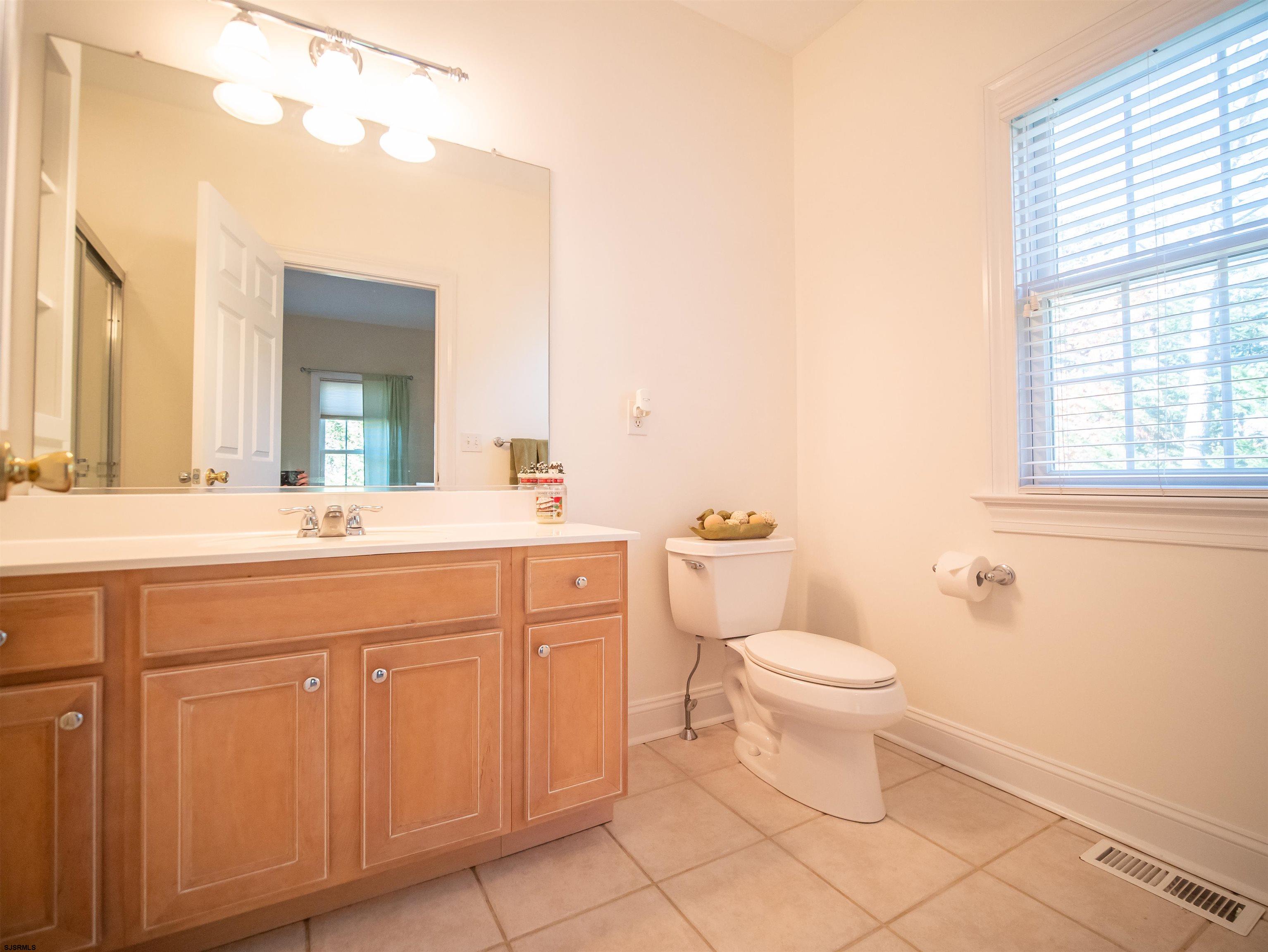 9 MGM Way Ocean View, NJ 08230 - Photo 36 of 61 a bathroom with a toilet sink and mirror