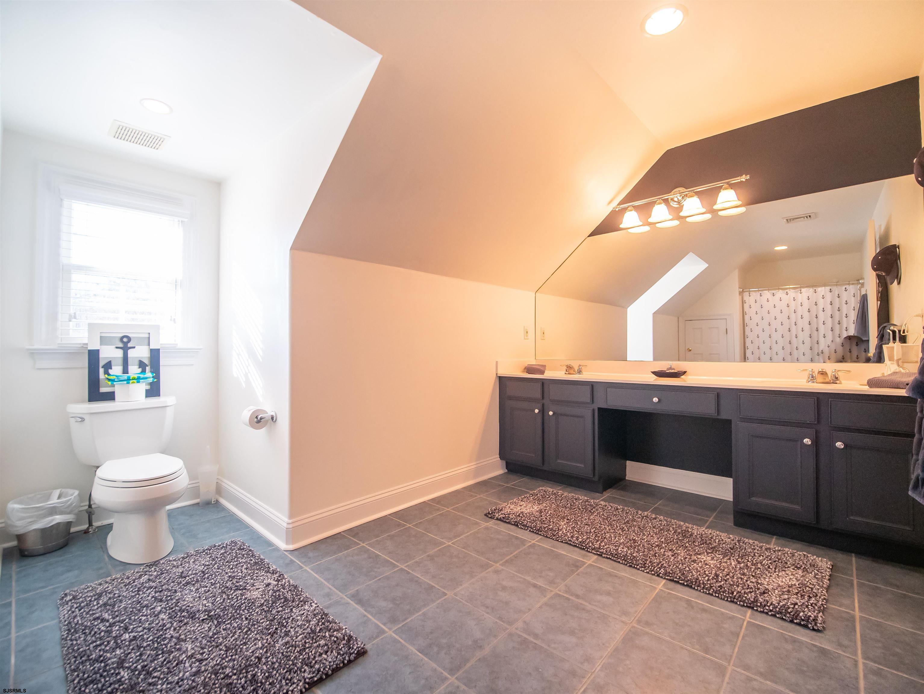 9 MGM Way Ocean View, NJ 08230 - Photo 38 of 61 a bathroom with a sink a toilet and a mirror