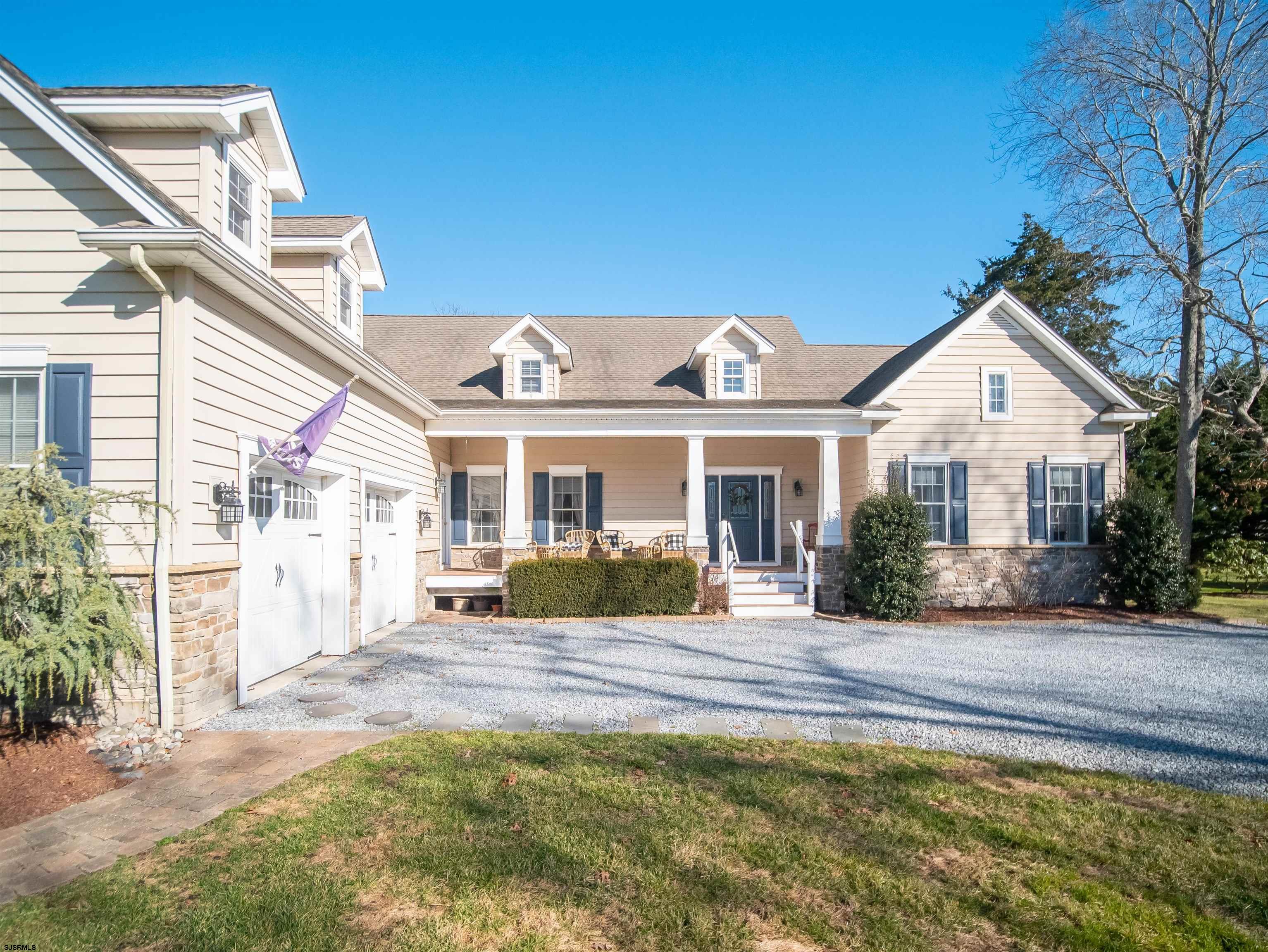 9 MGM Way Ocean View, NJ 08230 - Photo 4 of 61 a view of a house with a big yard and large tree