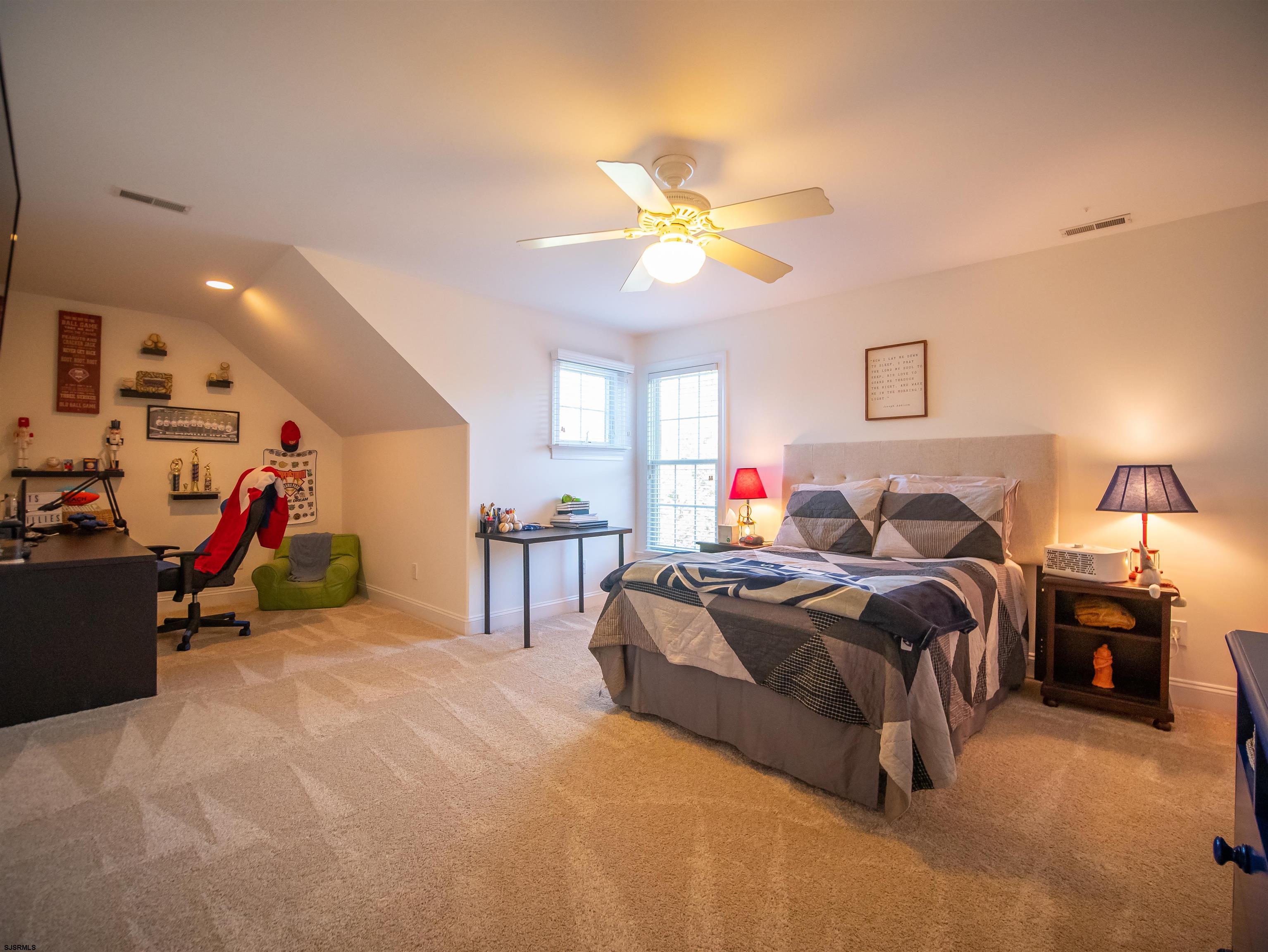 9 MGM Way Ocean View, NJ 08230 - Photo 41 of 61 a bed room with a bed and a lamp