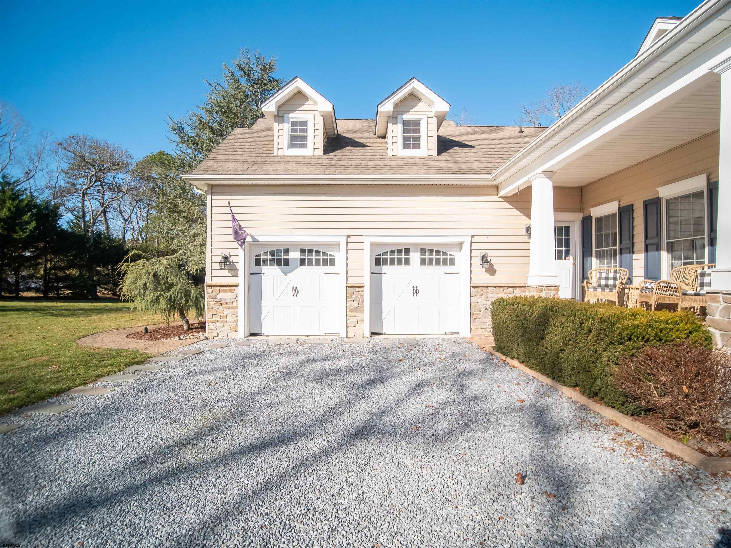 9 MGM Way Ocean View, NJ 08230 - Photo 47 of 61 a view of a house with a yard and plants