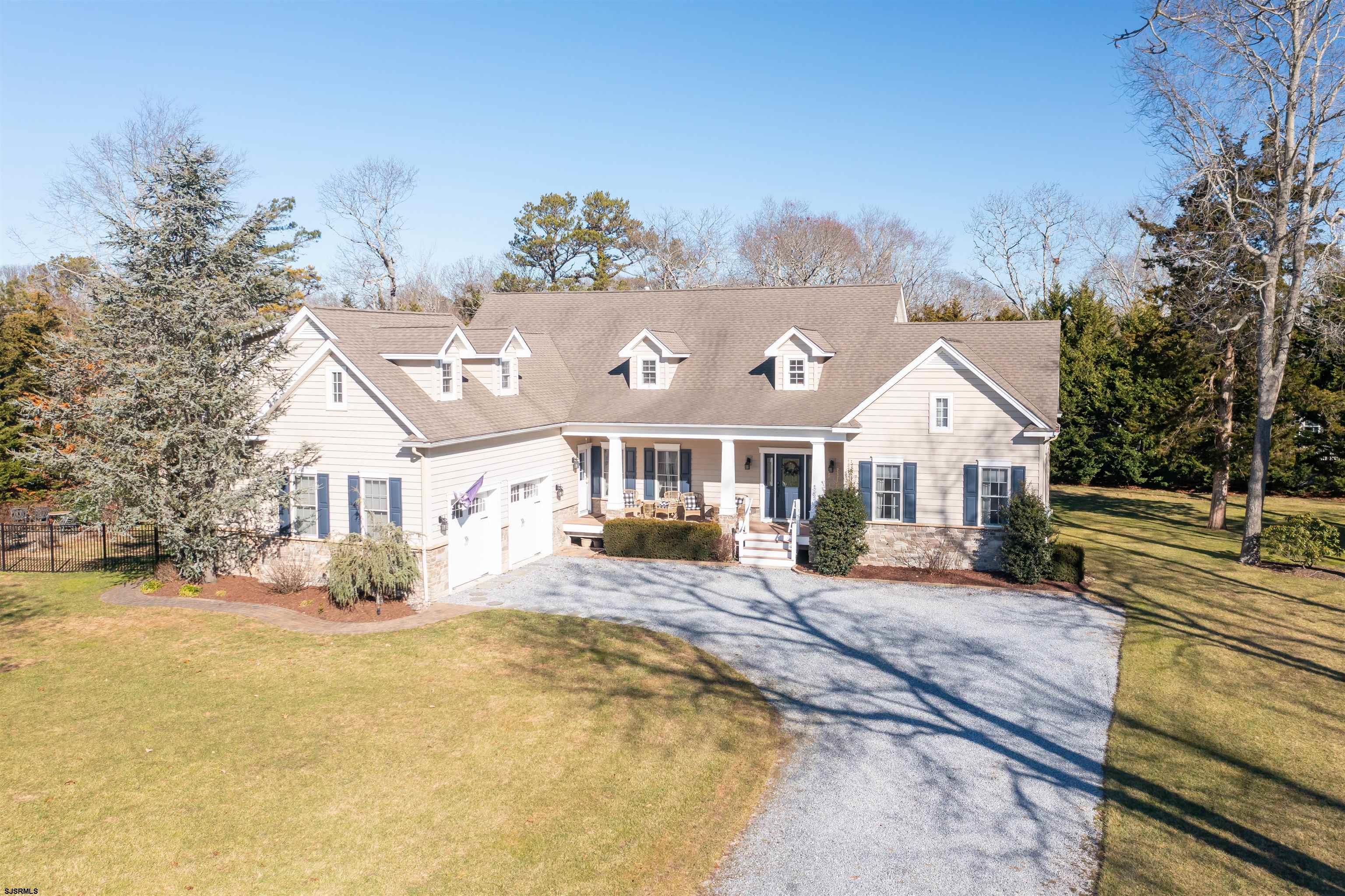 9 MGM Way Ocean View, NJ 08230 - Photo 51 of 61 a front view of a house with a yard and seating space