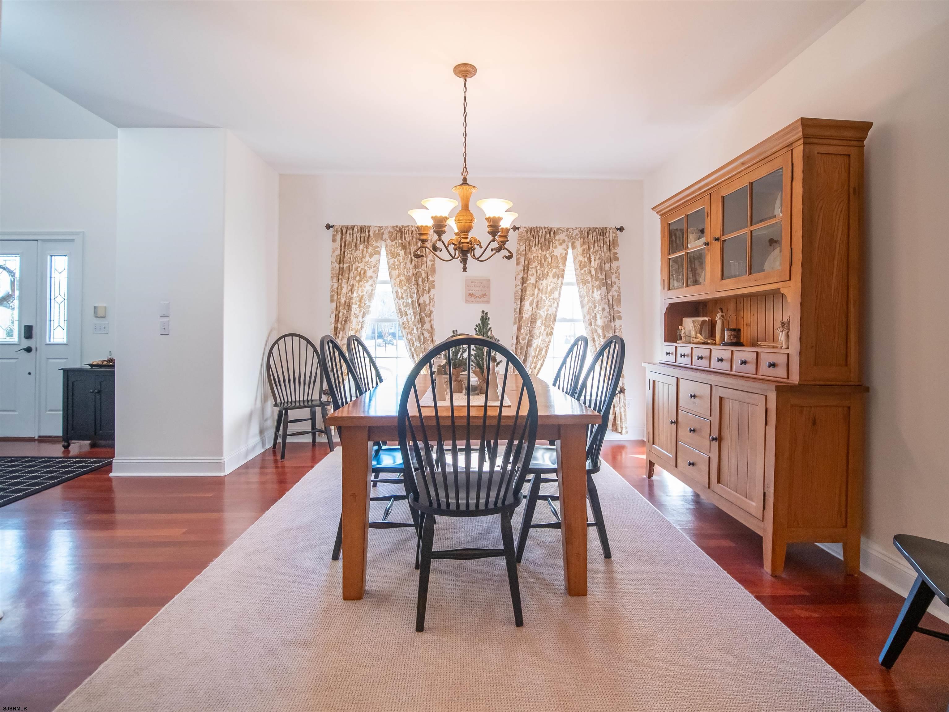 9 MGM Way Ocean View, NJ 08230 - Photo 9 of 61 a view of a dining room with furniture window and wooden floor