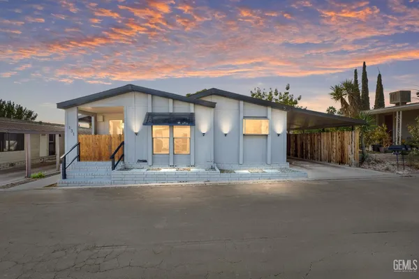 a view of a house with a yard and garage