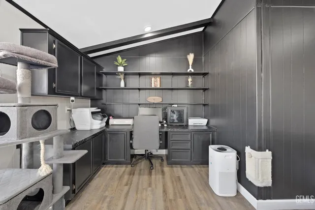 a kitchen with stainless steel appliances a stove a refrigerator and cabinets