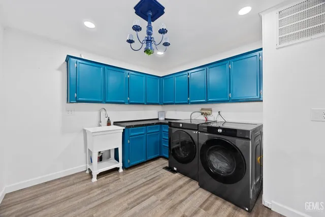 a kitchen with a stove cabinets and a sink