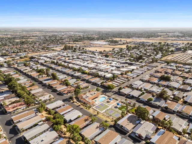 an aerial view of residential building with city view