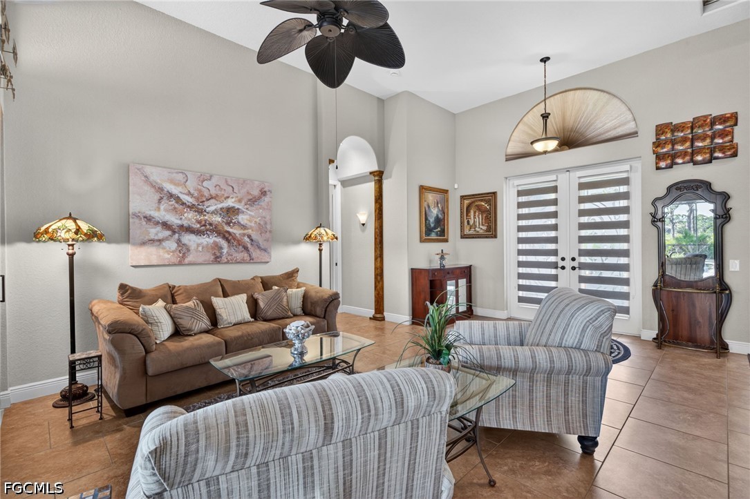 6109 Calusa Rdg Trail Bokeelia, FL 33922 - Photo 11 of 48 a living room with furniture ceiling fan and a rug