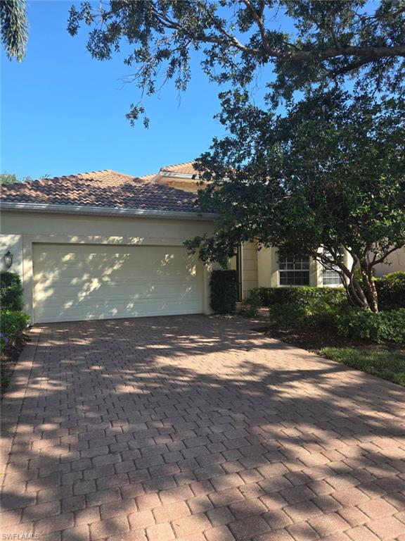 6719 Crowned Eagle Lane Naples, FL 34113 - Photo 1 of 23 a view of a house with a yard