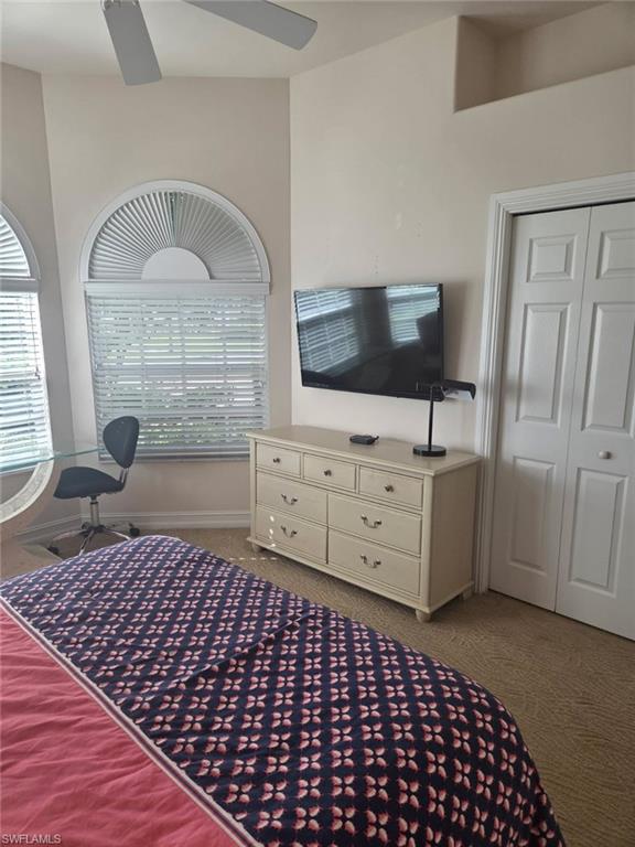 6719 Crowned Eagle Lane Naples, FL 34113 - Photo 18 of 23 a living room with a baby crib and a dresser