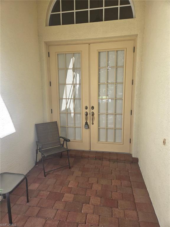 6719 Crowned Eagle Lane Naples, FL 34113 - Photo 19 of 23 a view of empty room with windows