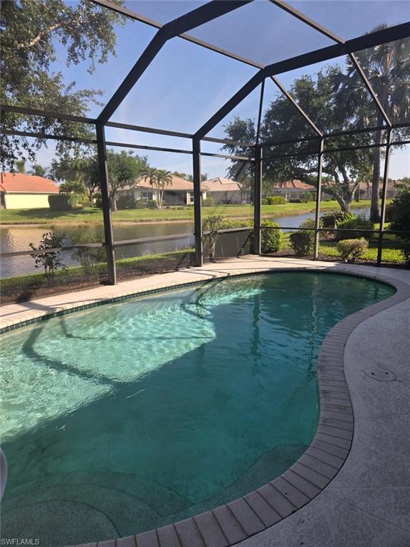 6719 Crowned Eagle Lane Naples, FL 34113 - Photo 2 of 23 a view of a backyard with sitting area