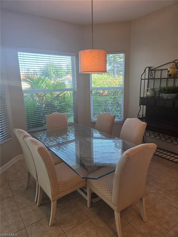 6719 Crowned Eagle Lane Naples, FL 34113 - Photo 5 of 23 a view of a dining room with furniture window and outside view