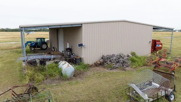 a view of a chairs and table in patio