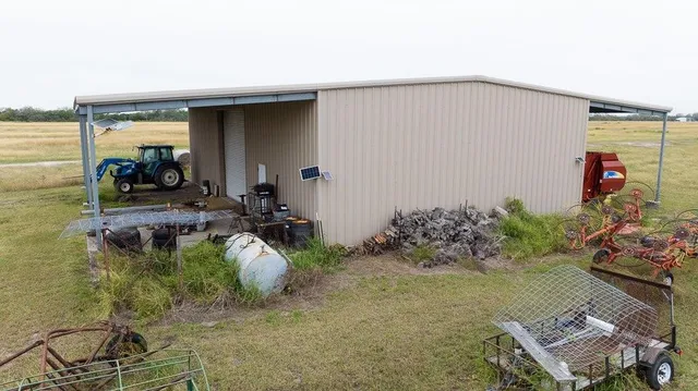 a view of a chairs and table in patio