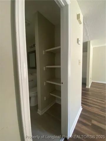 a view of a bathroom from a hallway