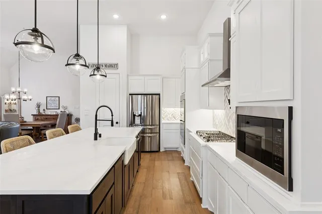 a view of wooden floor and windows in a room