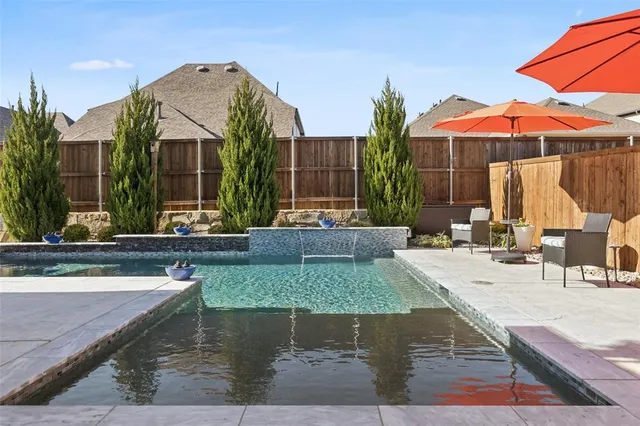 a front view of a house with a outdoor space