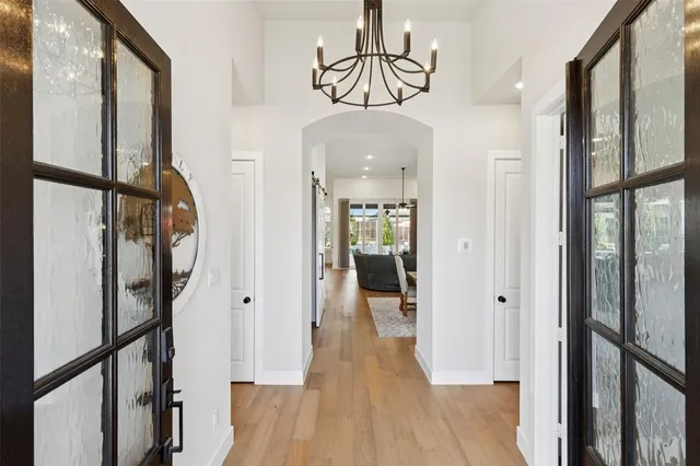 a view of a livingroom with workspace and a window