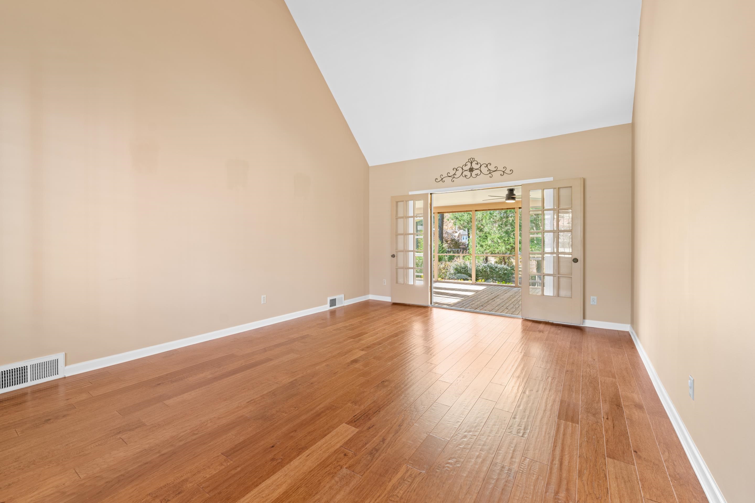 1751 Magnolia Tree Road Germantown, TN 38138 - Photo 14 of 36 an empty room with wooden floor and windows