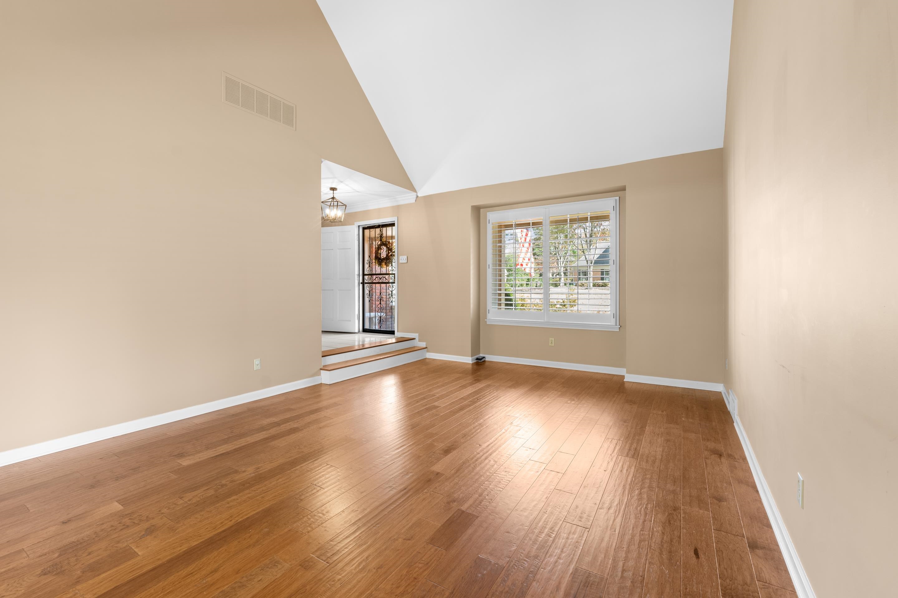 1751 Magnolia Tree Road Germantown, TN 38138 - Photo 15 of 36 an empty room with wooden floor and windows