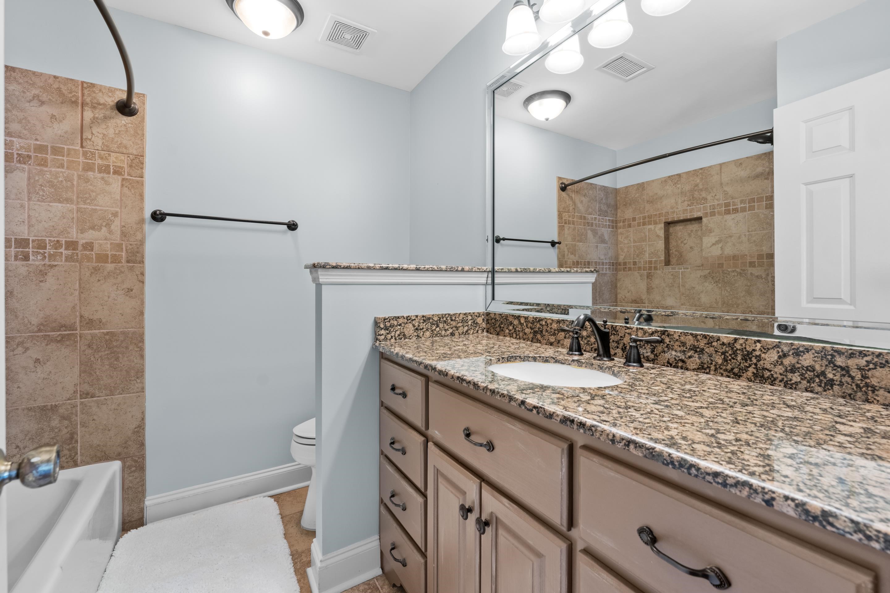 1751 Magnolia Tree Road Germantown, TN 38138 - Photo 20 of 36 a bathroom with a granite countertop sink toilet and shower