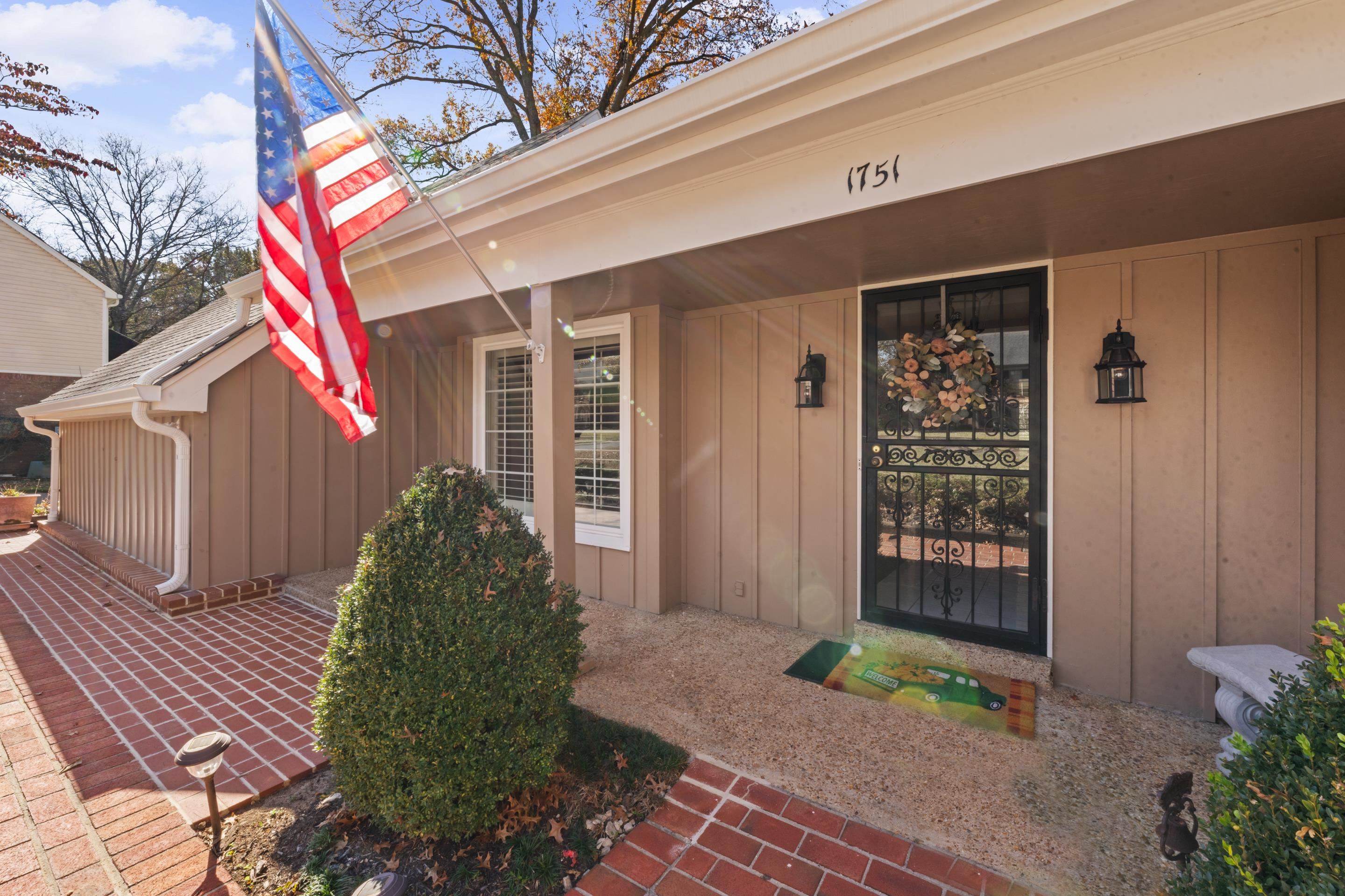 1751 Magnolia Tree Road Germantown, TN 38138 - Photo 2 of 36 a front view of a house with garden