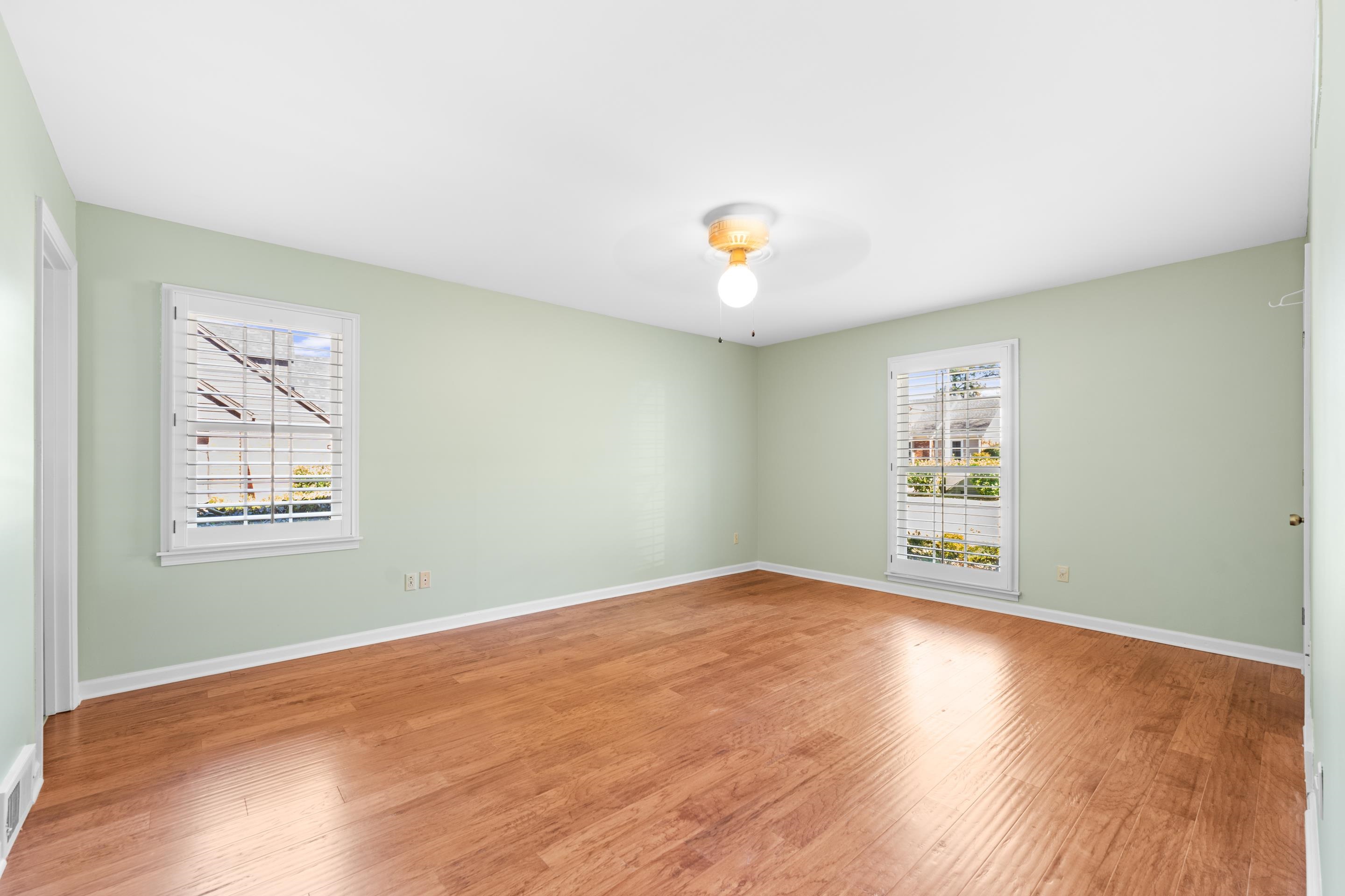 1751 Magnolia Tree Road Germantown, TN 38138 - Photo 25 of 36 an empty room with a window and wooden floor