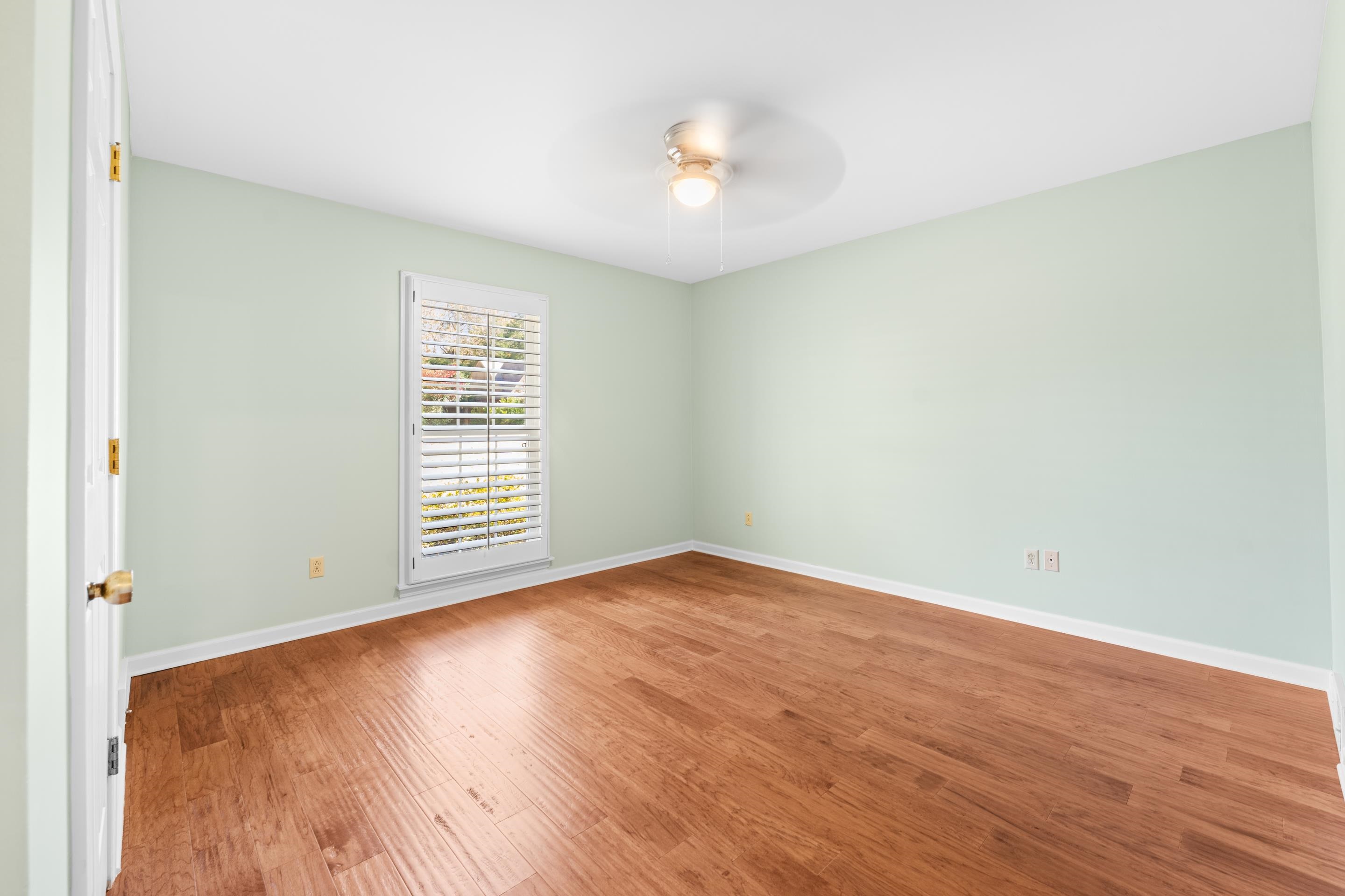 1751 Magnolia Tree Road Germantown, TN 38138 - Photo 26 of 36 a view of an empty room with wooden floor and a window