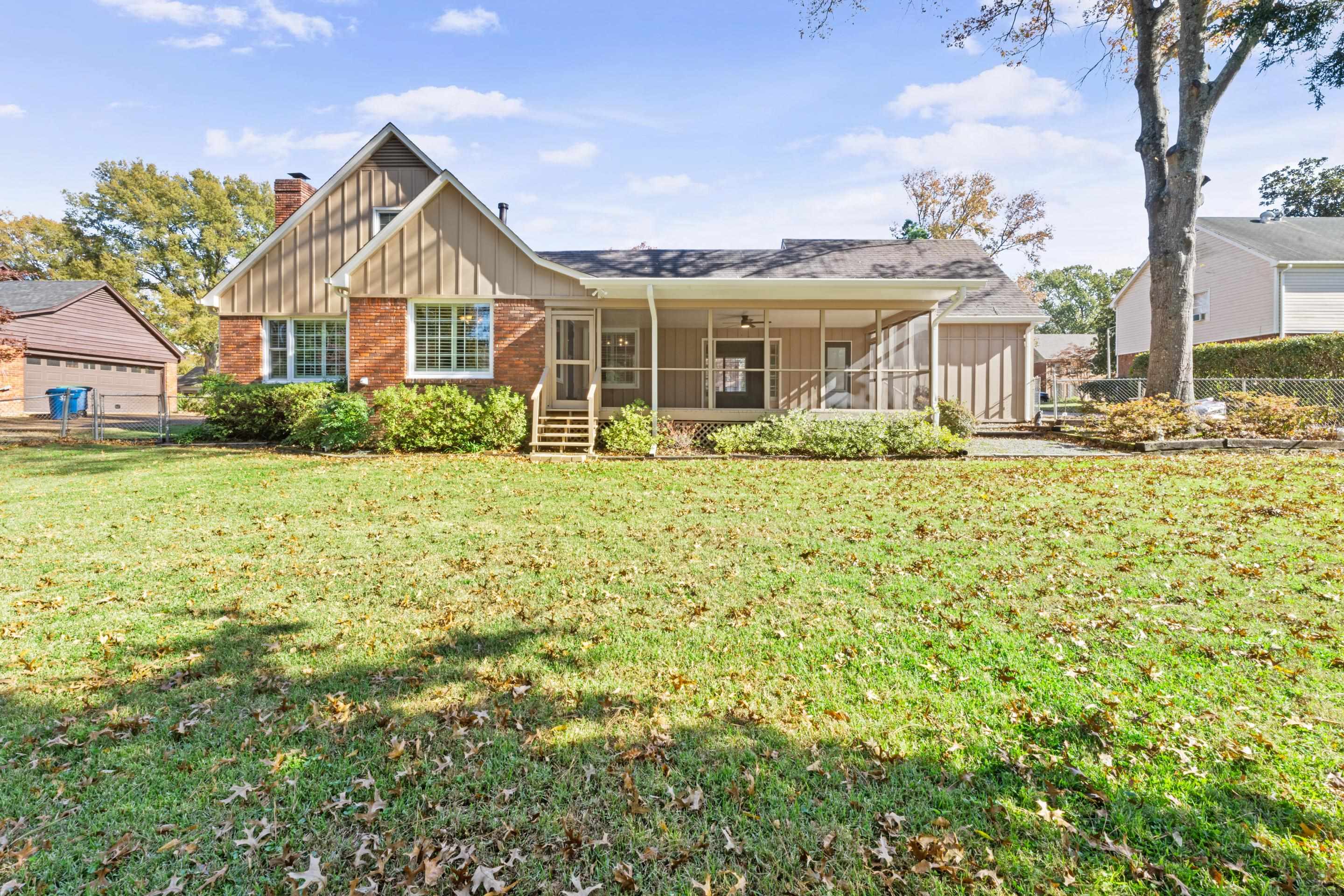 1751 Magnolia Tree Road Germantown, TN 38138 - Photo 34 of 36 a front view of a house with a yard
