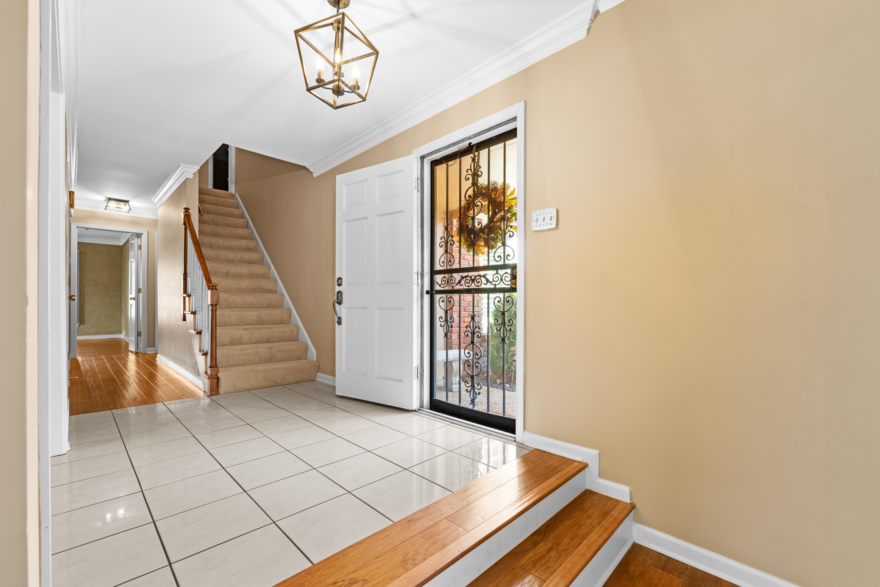 1751 Magnolia Tree Road Germantown, TN 38138 - Photo 6 of 36 a view of a livingroom with wooden floor and entryway