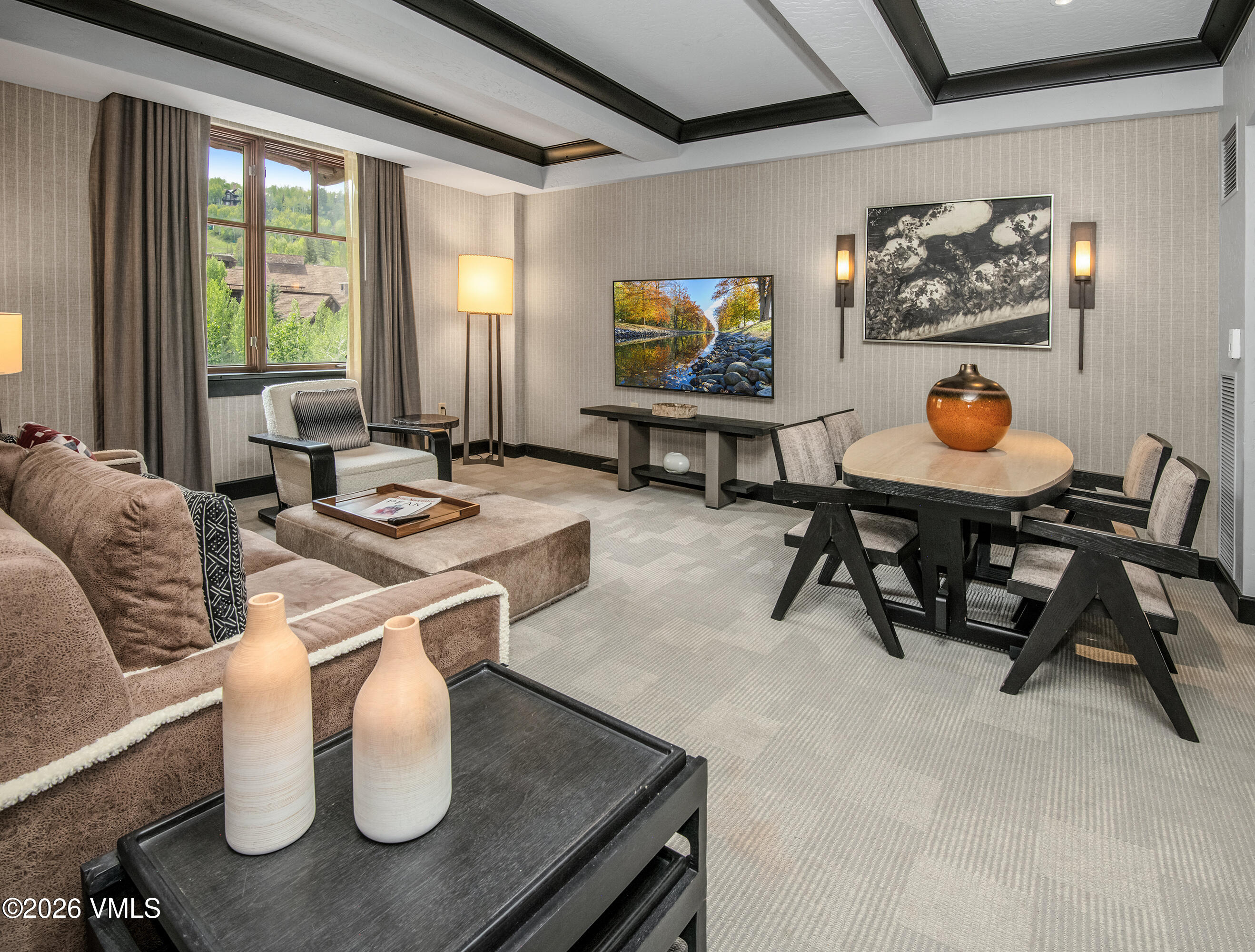 130 Daybreak Ridge Road, Unit HS716 Avon, CO 81620 - Photo 2 of 25 a living room with furniture a rug and a large window