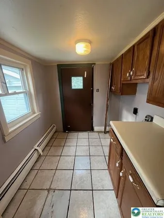 a kitchen with a sink a stove and a refrigerator