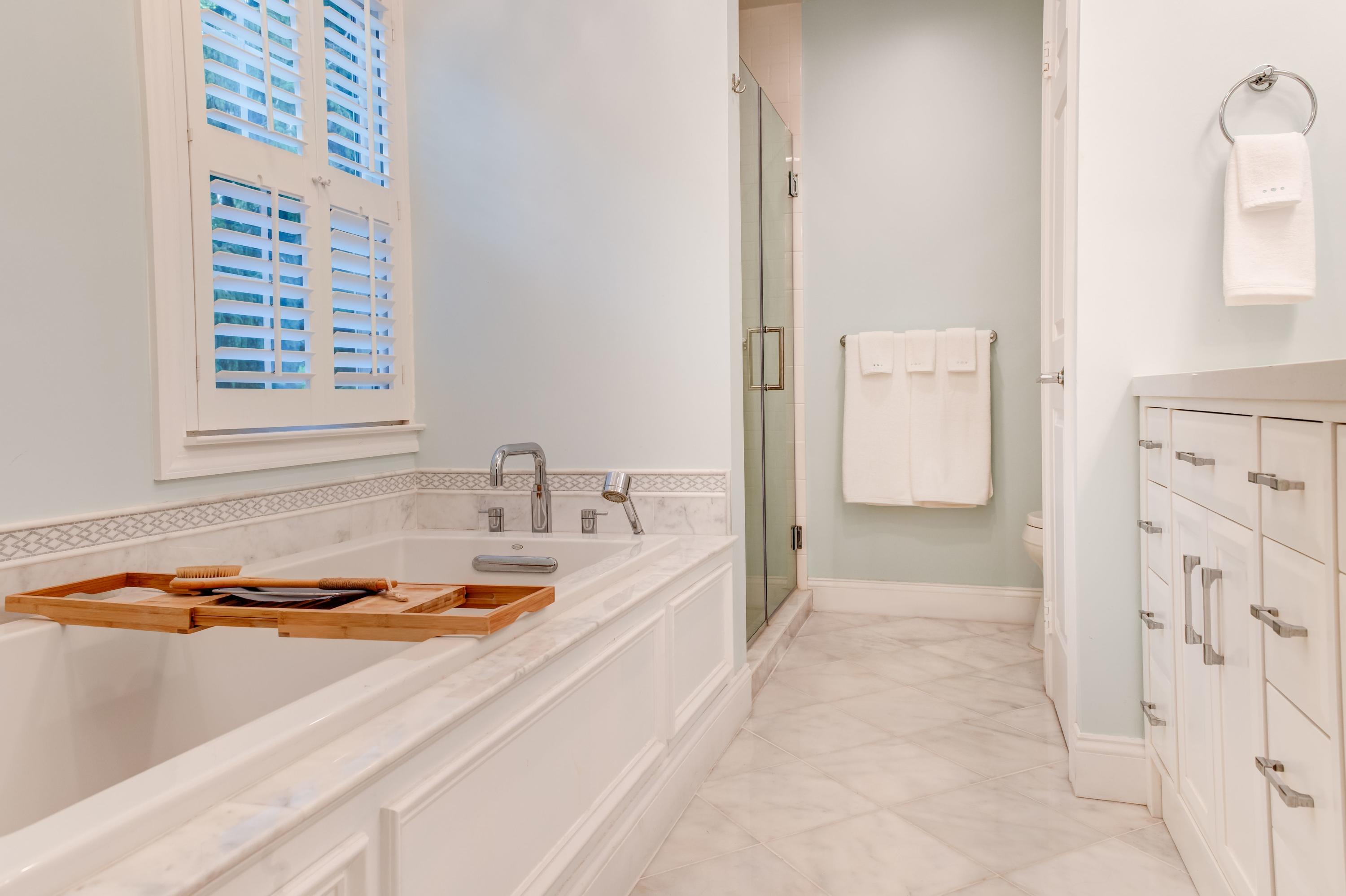134 Marshall Ridge Road New Canaan, CT 06840 - Photo 20 of 37 a bathroom with a tub sink and mirror