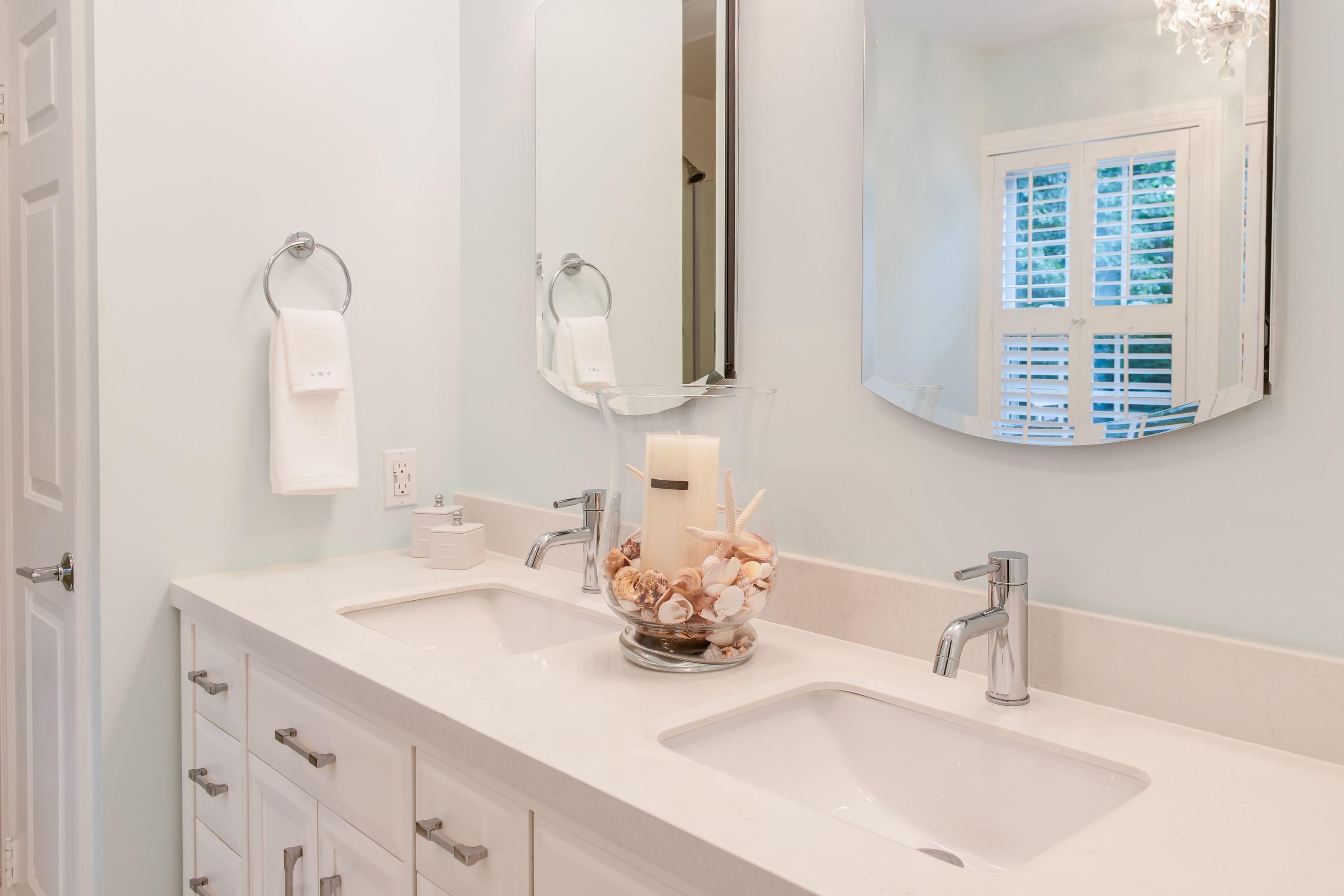 134 Marshall Ridge Road New Canaan, CT 06840 - Photo 21 of 37 a bathroom with a sink and a mirror