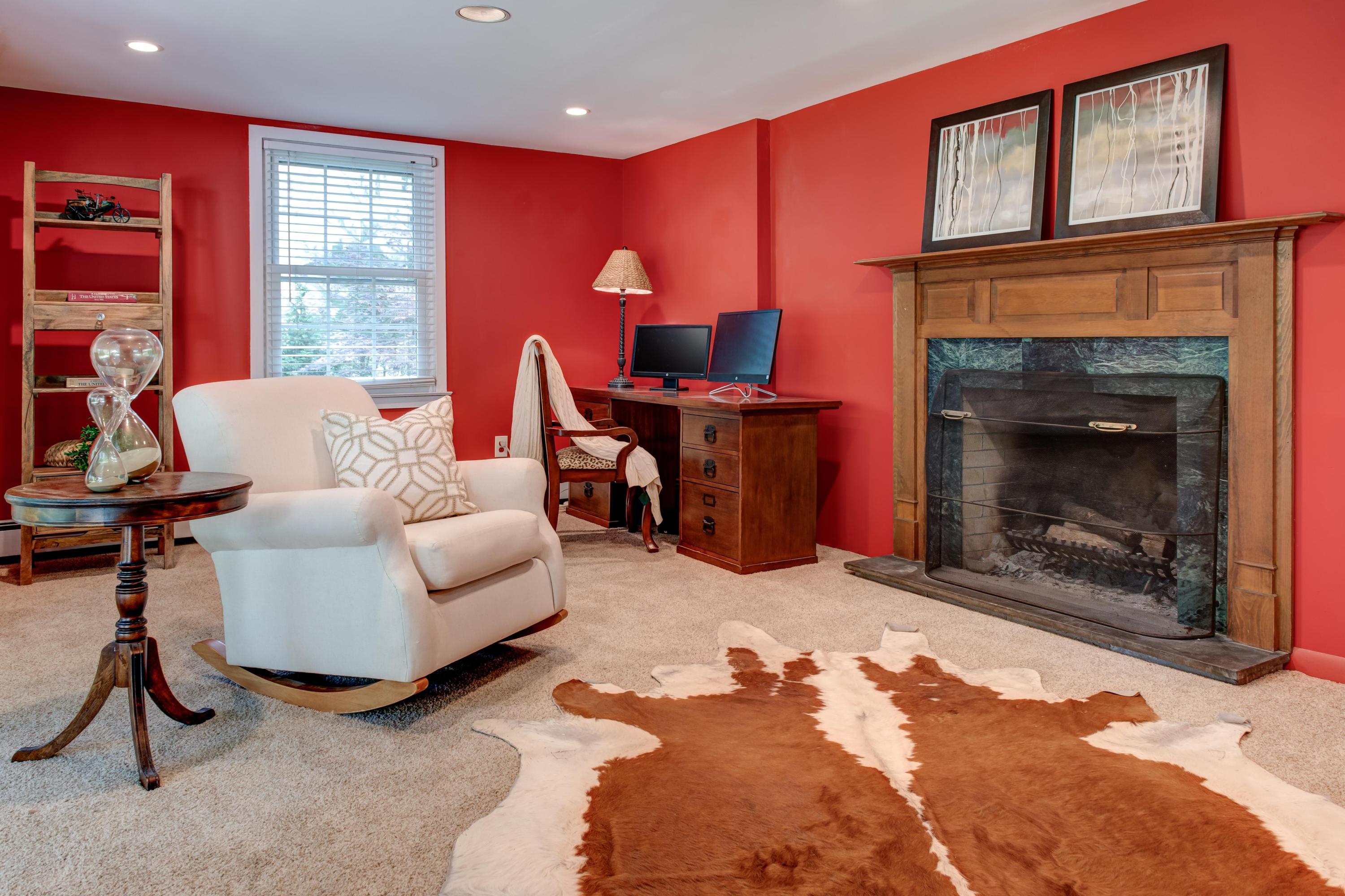 134 Marshall Ridge Road New Canaan, CT 06840 - Photo 28 of 37 a living room with furniture a window and a fireplace