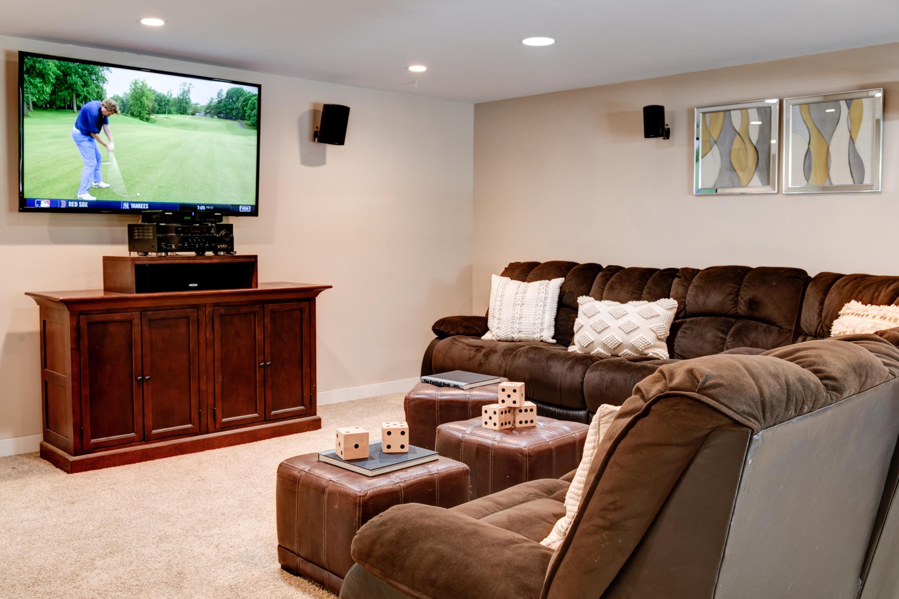 134 Marshall Ridge Road New Canaan, CT 06840 - Photo 30 of 37 a living room with furniture a flat screen tv and a window
