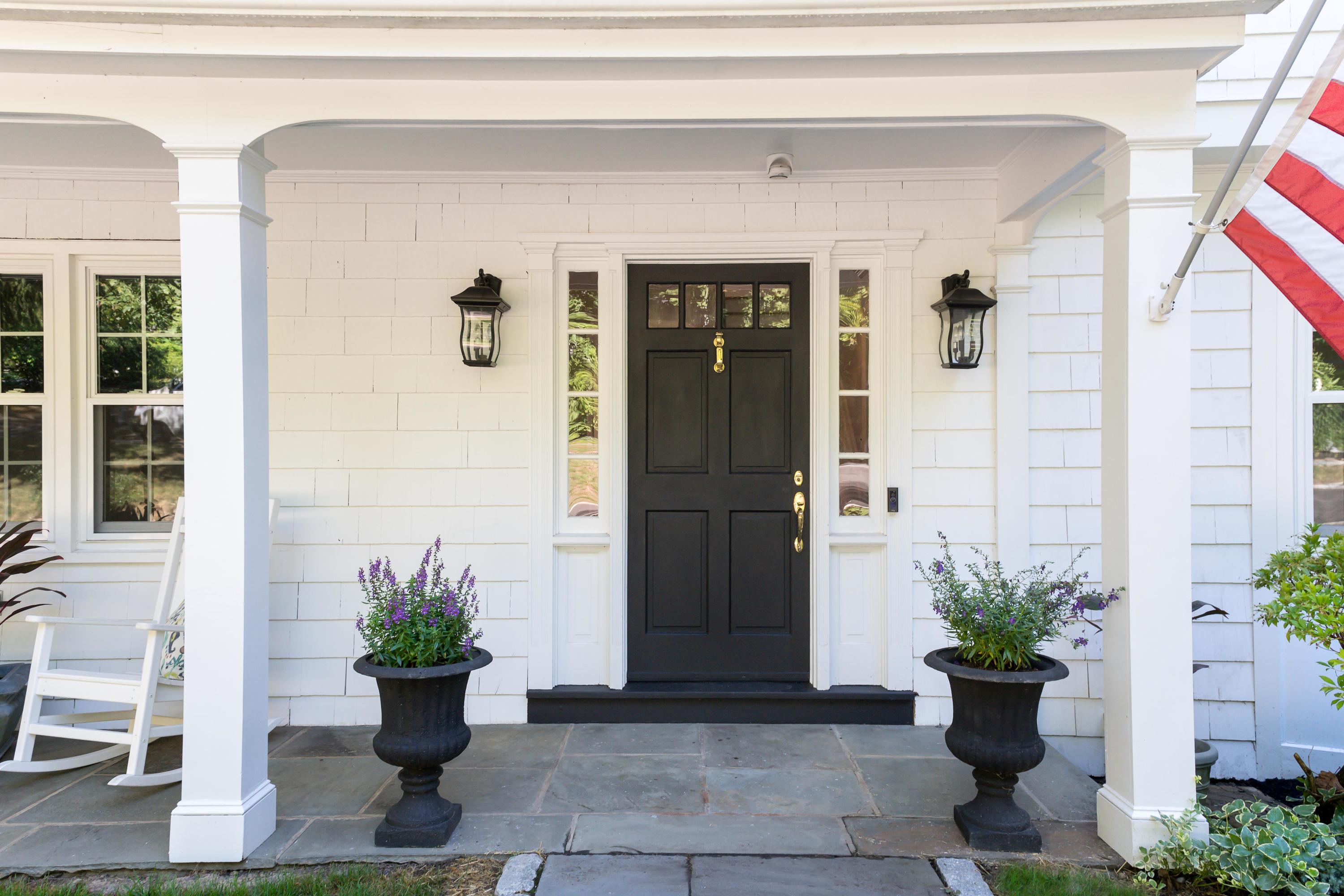 134 Marshall Ridge Road New Canaan, CT 06840 - Photo 4 of 37 a potted plant sitting in front of a house