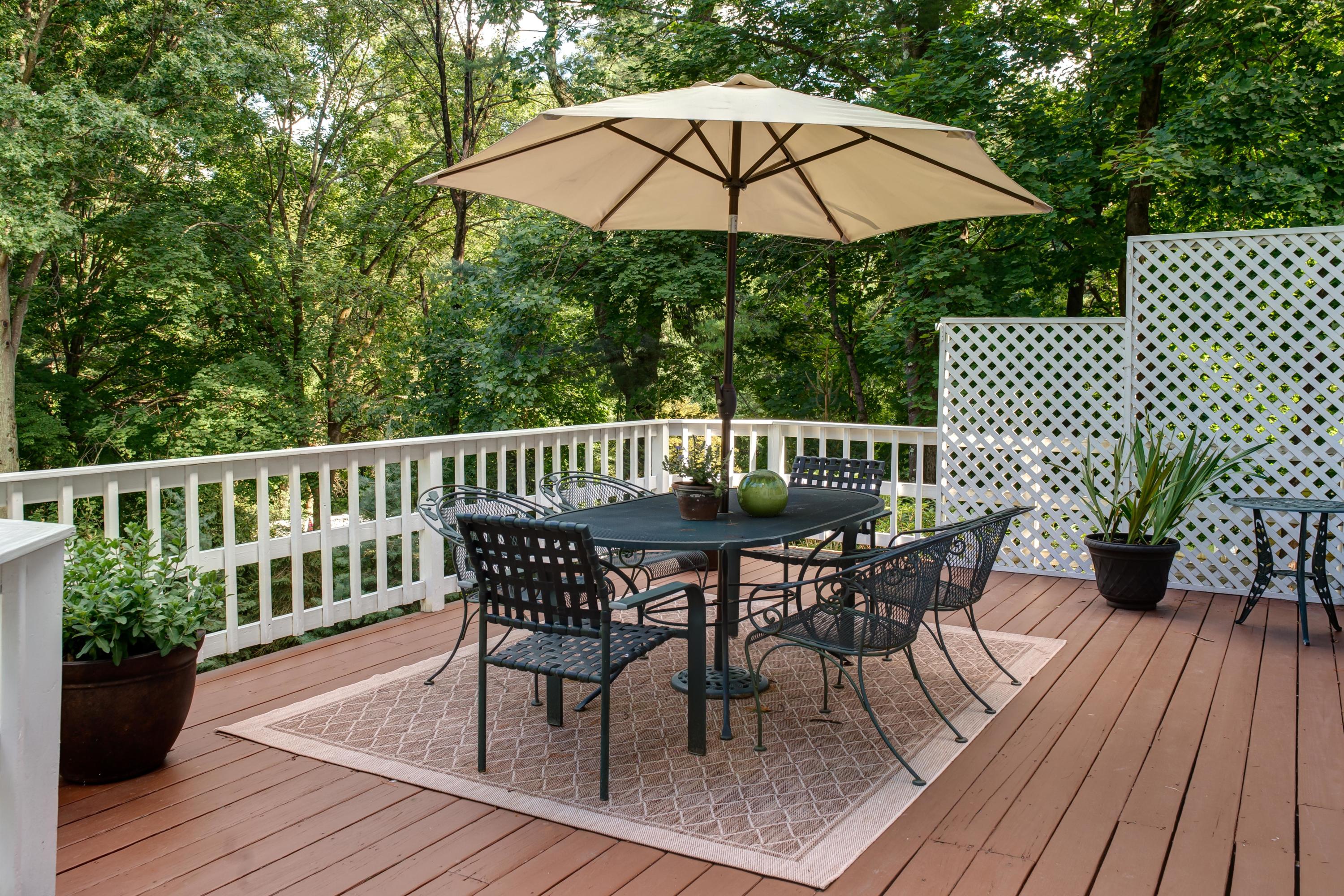 134 Marshall Ridge Road New Canaan, CT 06840 - Photo 33 of 37 a view of a deck with furniture and barbeque