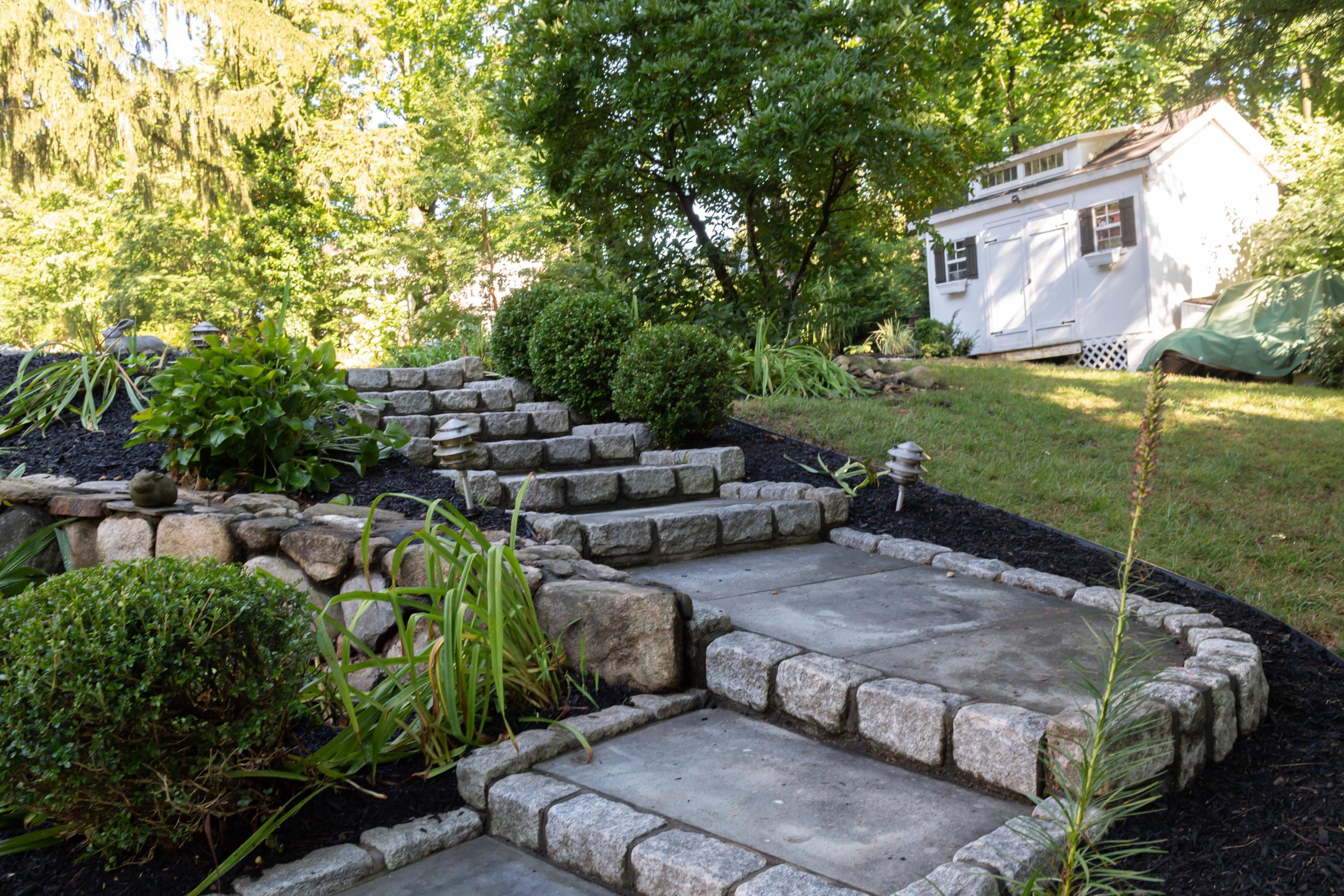 134 Marshall Ridge Road New Canaan, CT 06840 - Photo 35 of 37 a backyard of a house with lots of green space