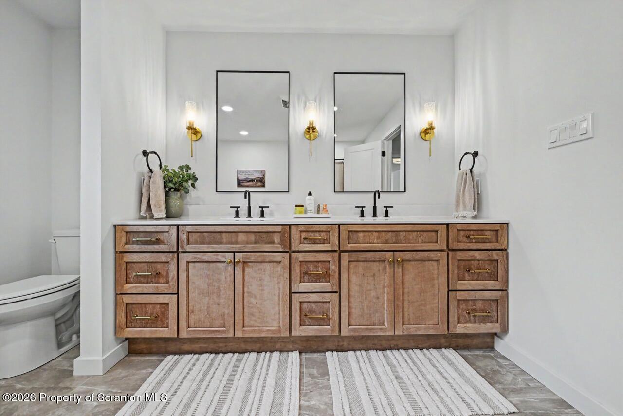 100 Highland Road Moscow, PA 18444 - Photo 51 of 85 a bathroom with a sink a toilet and mirror