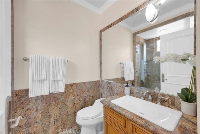 a bed room with a bed and a tv