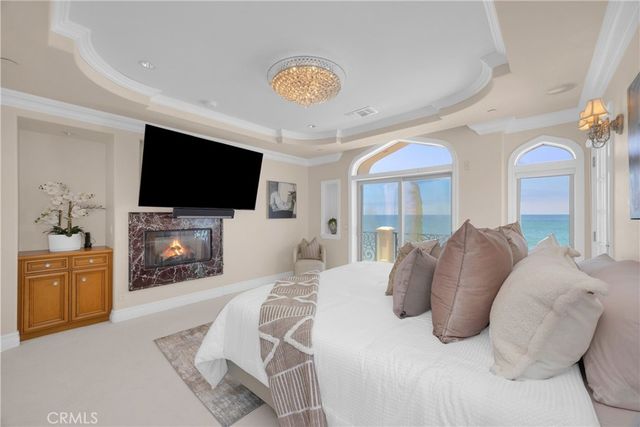 a view of a dining room with furniture wooden floor and chandelier