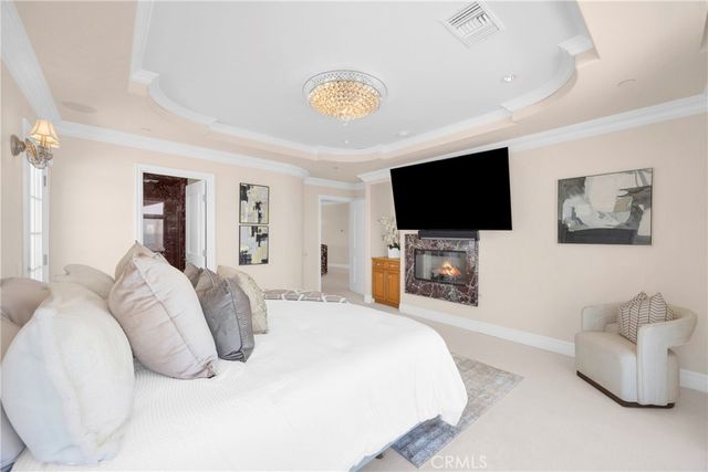 a view of a dining room with furniture large windows and wooden floor