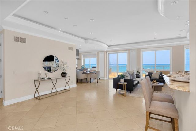 a living room with fireplace furniture and a flat screen tv