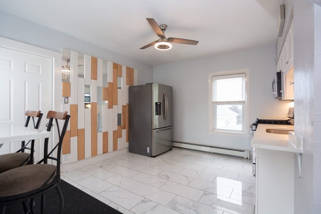 14 Russell Street Everett, MA 02149 - Photo 12 of 32 a living room with furniture and a window