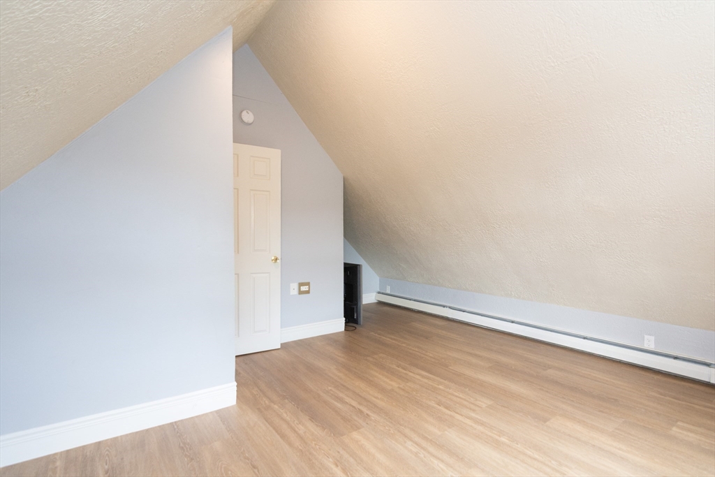 14 Russell Street Everett, MA 02149 - Photo 17 of 32 a view of empty room with wooden floor