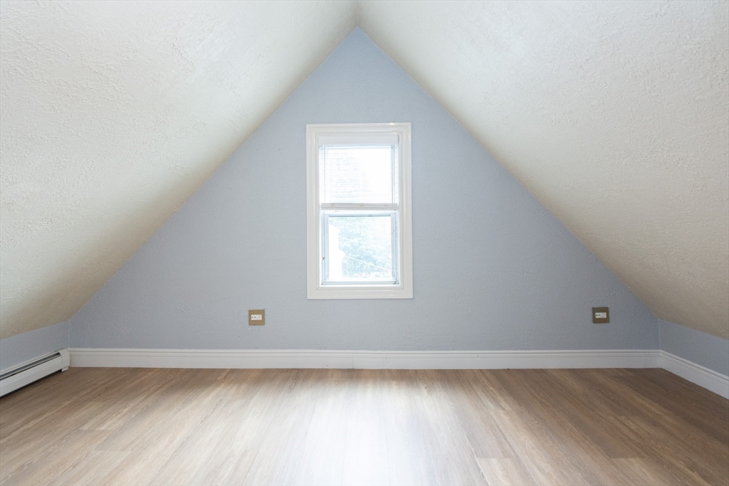 14 Russell Street Everett, MA 02149 - Photo 19 of 32 a view of a room that has wooden floor and window