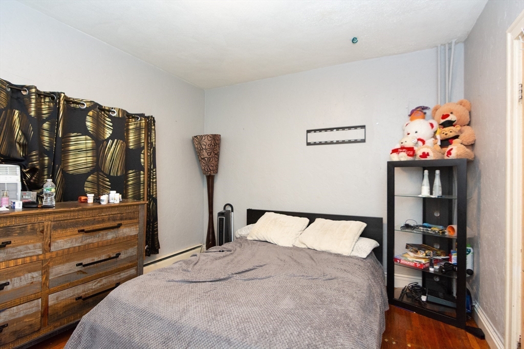 14 Russell Street Everett, MA 02149 - Photo 25 of 32 a bedroom with a bed and a window