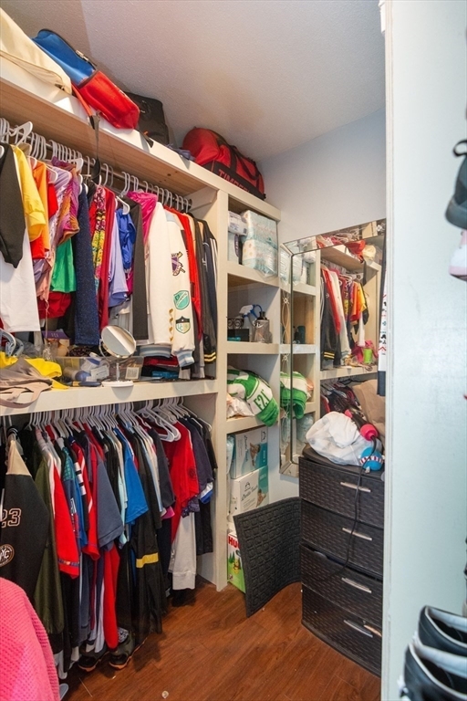 14 Russell Street Everett, MA 02149 - Photo 26 of 32 a view of walk in closet with clothes and shoes